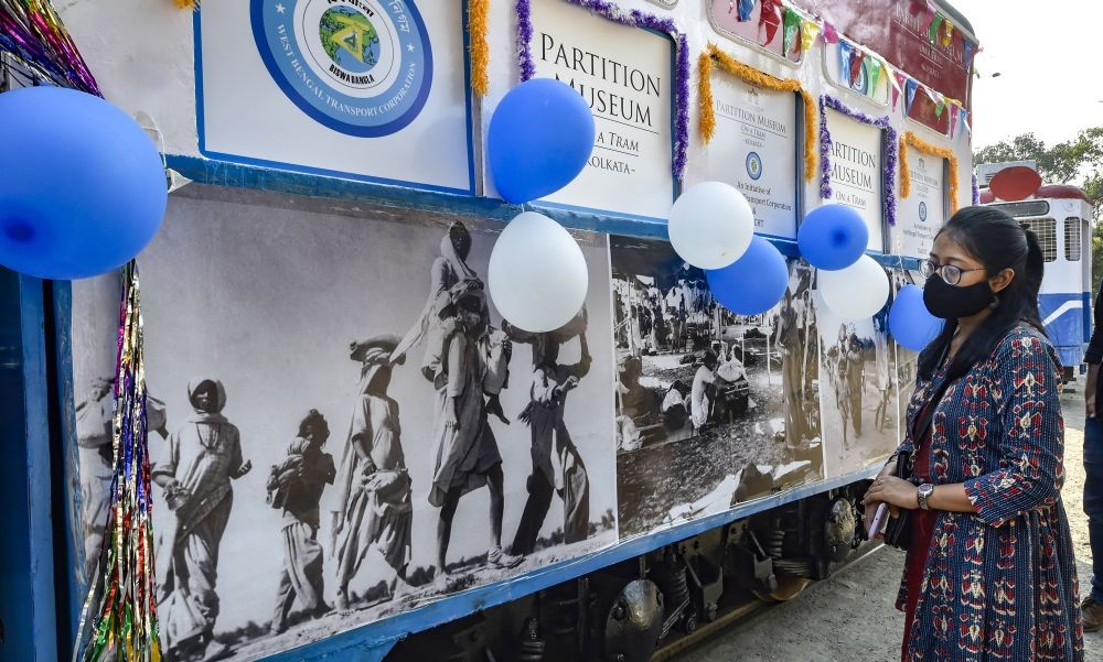 Kolkata: A visitor looks at a photo-exhibition, 'Partition Musuem', on a tram in Kolkata, Monday, Feb. 15, 2021. (PTI Photo/Ashok Bhaumik)