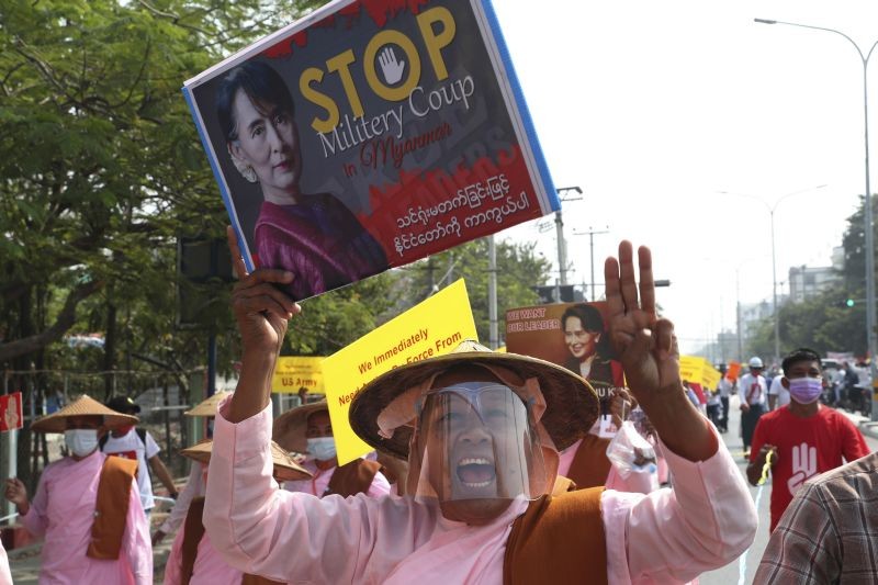 Buddhist nuns display images of deposed Myanmar leader Aung San Suu Kyi during a street march in Mandalay, Myanmar on February 26, 2021. In the country's second-largest city, anti-coup protesters  took to the streets Friday. By midday, security forces had blocked the main road in downtown Mandalay to prevent the protesters from gathering. (AP/PTI Photo)