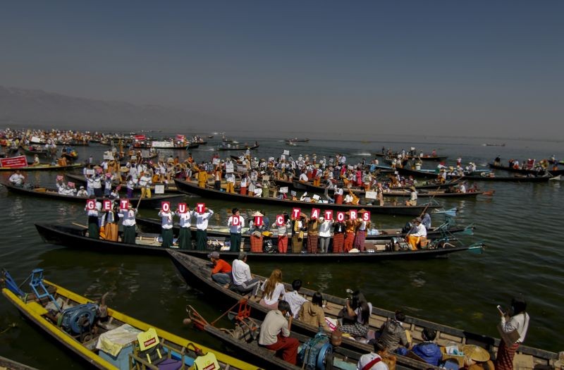 Ethnic Entha community display placards during a protest against the military coup in Inle Lake, Taunggyi, Myanmar on February 11, 2021. Large crowds demonstrating against the military takeover in Myanmar again defied a ban on protests Thursday, even after security forces ratcheted up the use of force against them and raided the headquarters of the political party of ousted leader Aung San Suu Kyi a day earlier. (AP/PTI)