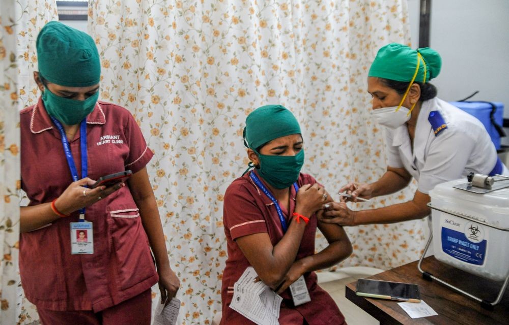 Mumbai: A medic administers the first dose of COVID vaccine to a frontline worker, during a COVID-19 inoculation drive at Babasaheb Ambedkar Municipal General Hospital, Kandivali in Mumbai, Wednesday, Feb 24, 2021. (PTI Photo)