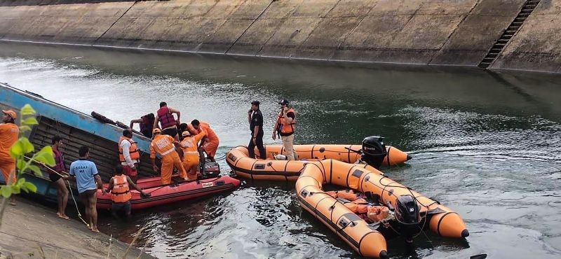 NDRF team carries out rescue operation after an overcrowded bus plunged into a canal in Sidhi district of Madhya Pradesh on Febryuary 16. Around 30 bodies have been recovered from canal. (PTI Photo)