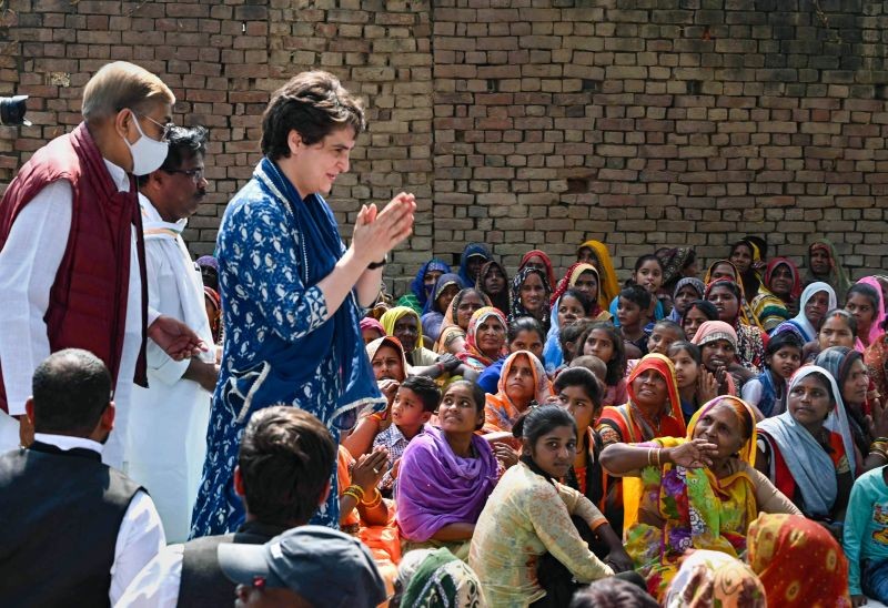 Prayagraj: All India Congress Committee (AICC) General Secretary Priyanka Gandhi Vadra meets boatmen and their families, who were allegedly harassed by local police few weeks ago, at Baswar village in Prayagraj, Sunday, Feb. 21, 2021. (PTI Photo)