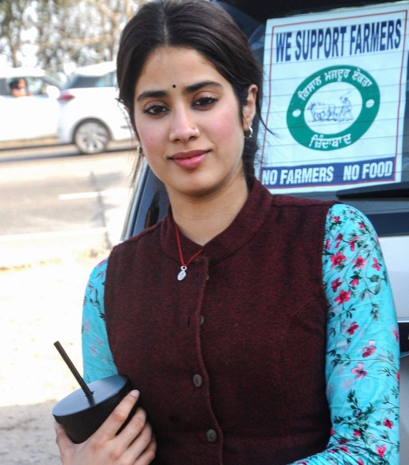 Patiala: Bollywood actress Janhvi Kapoor, with a placard supporting farmers pasted on a vehicle behind her, during shooting of her upcoming film ‘Good Luck Jerry’, in Patiala, Friday, Feb 26, 2021. (PTI Photo)