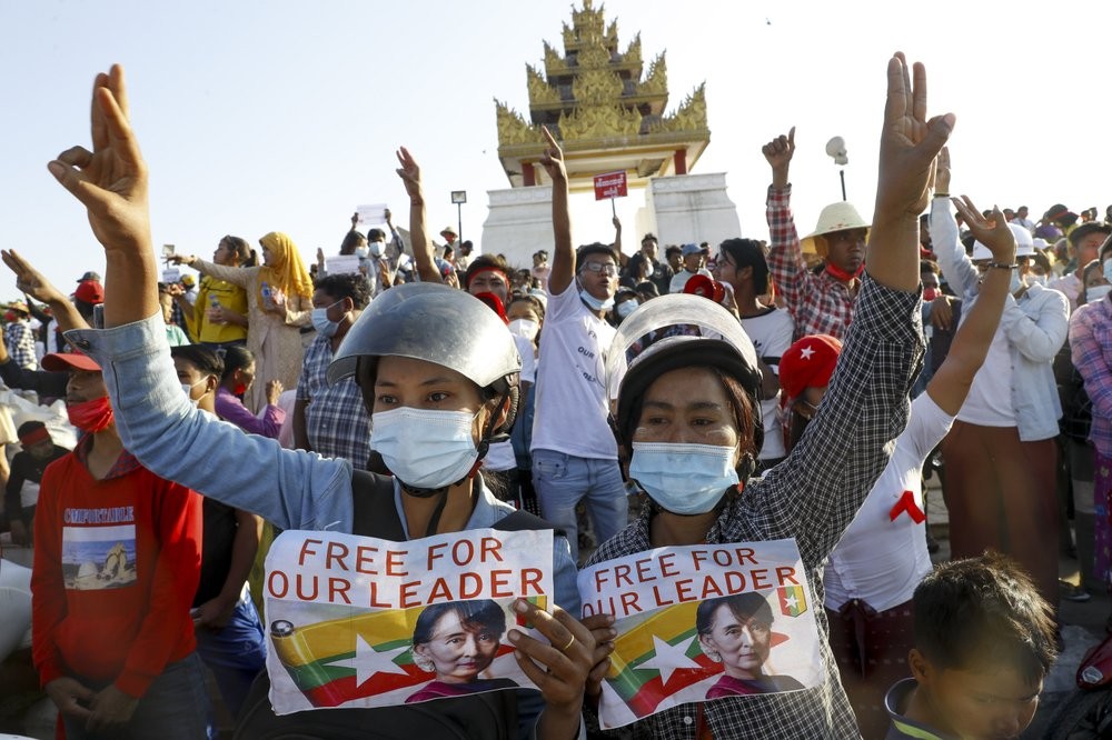 Demonstrators display placards calling for the release of detained Myanmar leader Aung San Suu Kyi and flash three-fingered salutes, a symbol of resistance, against the military coup during a protest in Mandalay, Myanmar, Wednesday, Feb. 10, 2021. Protesters continued to gather Wednesdayin Mandalay breaching Myanmar's new military rulers' decrees that effectively banned peaceful public protests in the country's two biggest cities. (AP Photo)