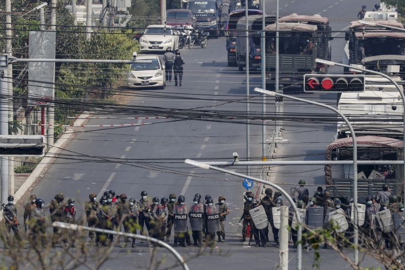 Police stand in formation blocking a main road in Mandalay, Myanmar on February 27, 2021. Myanmar security forces cracked down on anti-coup protesters in the country's second-largest city Mandalay on Friday, injuring at least three people, two of whom were shot in the chest by rubber bullets and another who suffered a wound on his leg. (AP/PTI Photo)