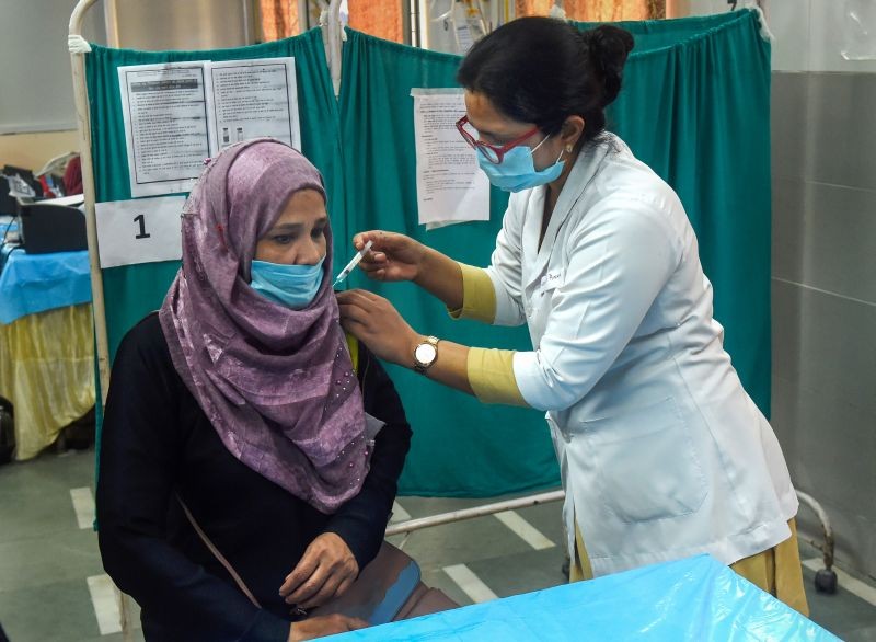 A sanitation worker receives the first dose of Covaxin vaccine, at Hindu Rao Hospital, in New Delhi on February 16, 2021. (PTI Photo)