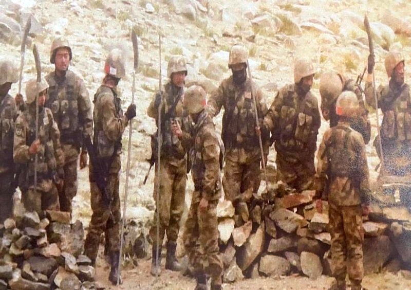 Chinese soldiers seen carrying spears and other sharp edged weapons. (IANS Photo)