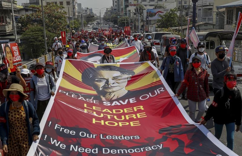 Demonstrators display pictures of detained Myanmar leader Aung San Suu Kyi during a protest against the military coup in Mandalay, Myanmar on February 16, 2021. Security forces in Myanmar pointed guns toward anti-coup protesters and attacked them with sticks Monday, seeking to quell the large-scale demonstrations calling for the military junta that seized power this month to reinstate the elected government. (AP/PTI Photo)