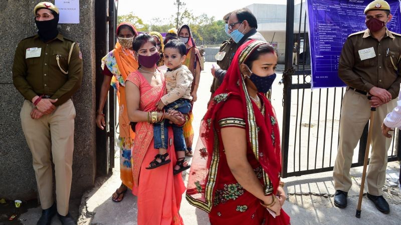 New Delhi: Women voters leave after casting their votes during the Municipal By-polls at Kalyanpuri area in New Delhi, Sunday, Feb. 28, 2021. (PTI Photo/Kamal