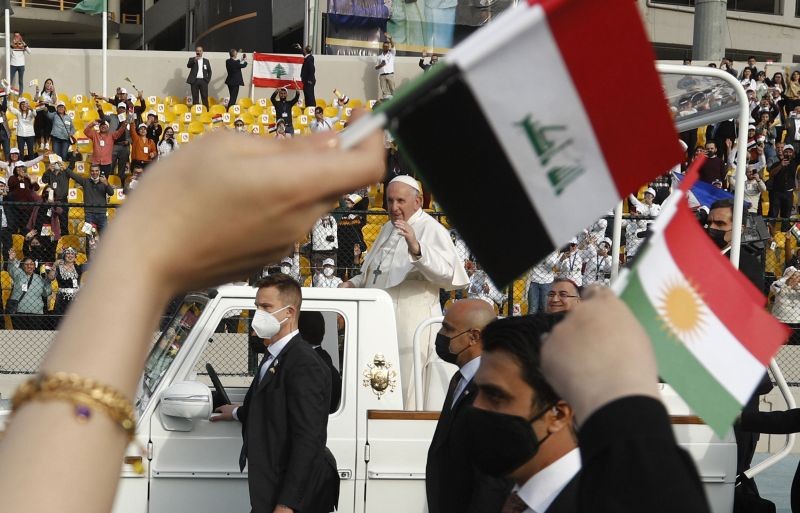 Pope Francis waves as he arrives for an open air Mass at a stadium in Irbil, Iraq on March 7, 2021. Thousands of people filled the sports stadium in the northern city of Irbil for Pope Francis' final event in his visit to Iraq: an open-air Mass featuring a statue of the Virgin Mary that was restored after Islamic militants chopped of the head and hands. (AP/PTI Photo)