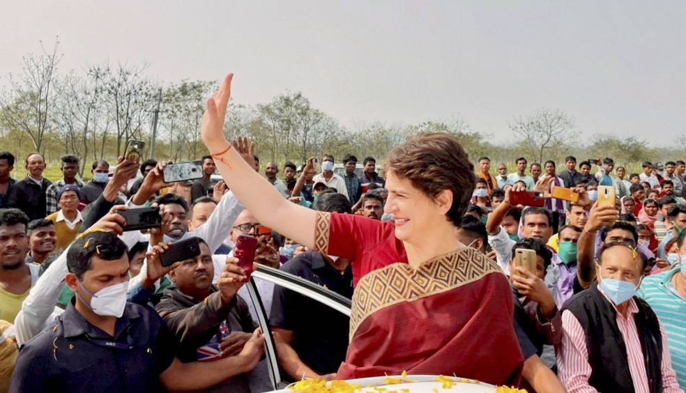 Biswanath: All India Congress Committee (AICC) General Secretary Priyanka Gandhi Vadra waves at tea garden workers on her arrival at Sadharu in Biswanath, Assam. (PTI Photo).