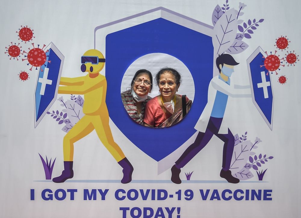 Mumbai: Senior citizens pose for photographs with a cut-out on being administered the COVID-19 vaccine at a paid centre at SRCC Hospital, in Mumbai, Saturday, March 6, 2021. (PTI Photo/Kunal Patil)