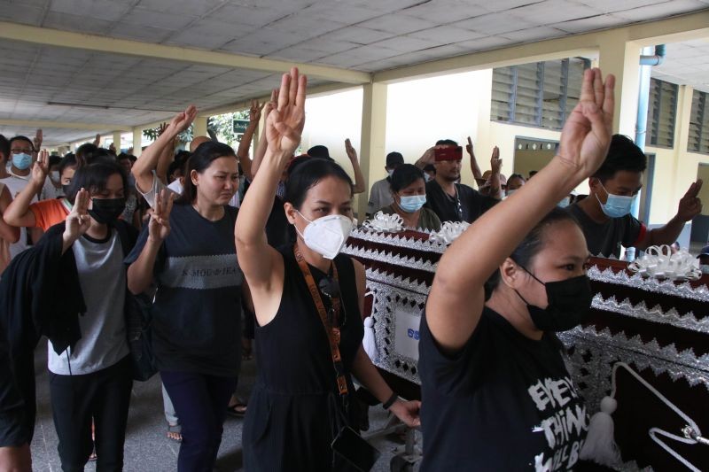 People carry the coffin of a woman who was killed during a clash with Myanmar's security forces, during her cremation in Yangon, Myanmar on March 29, 2021. Over 100 people across the country were killed by security forces on Saturday alone, including several children ‚' a toll that has prompted a U.N. human rights expert to accuse the junta of committing ‚'mass murder‚' and to criticize the international community for not doing enough to stop it. (AP/PTI Photo)