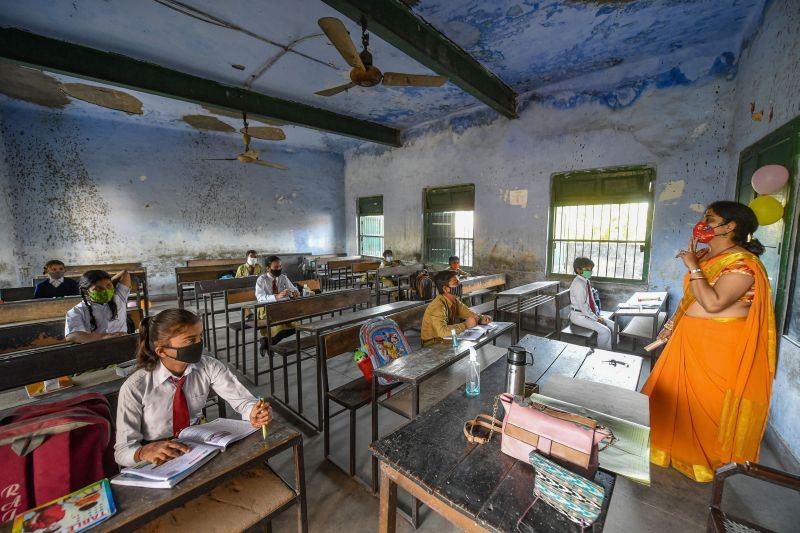 A teacher takes a class after schools reopened for the students of classes 1st to 5th, with certain COVID-19 safety guidelines, in Lucknow on March 1, 2021. (PTI Photo)