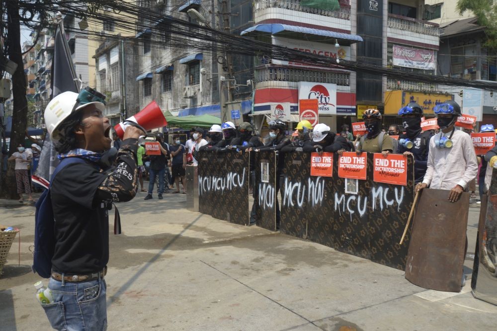 Anti-coup protesters gather with makeshift shields during a demonstration in Yangon, Myanmar, Friday, March 12, 2021. Myanmar's security forces shot to death at least 10 people protesting the military's coup Thursday, spurning a U.N. Security Council appeal to stop using lethal force and as an independent U.N. expert cited growing evidence of crimes against humanity. (Photo by AP Photo/Stringer)
