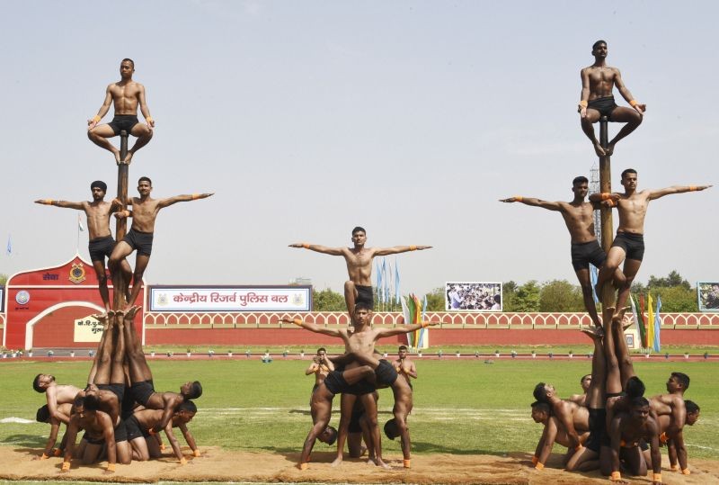 Gurugram: CRPF jawans perfor 'Malkhambh' during their 82nd Raising Day function, at CRPF Academy Kadarpur, in Gurugram, Friday, March 19, 2021. (PTI Photo) 