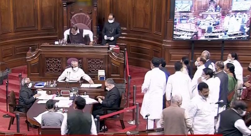 Opposition leaders stage a protest over rise in fuel prices in Rajya Sabha during the Budget Session of Parliament, in New Delhi on March 8. (RSTV/PTI Photo)