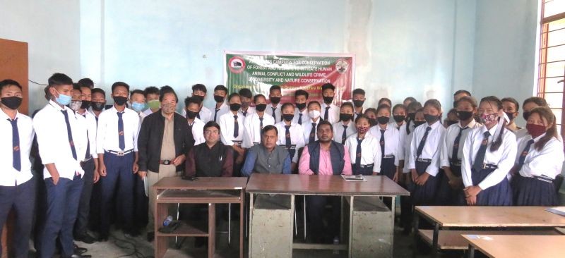 Officials with participants during the awareness campaign held at Government Senior Higher Secondary School, Mon on March 16.