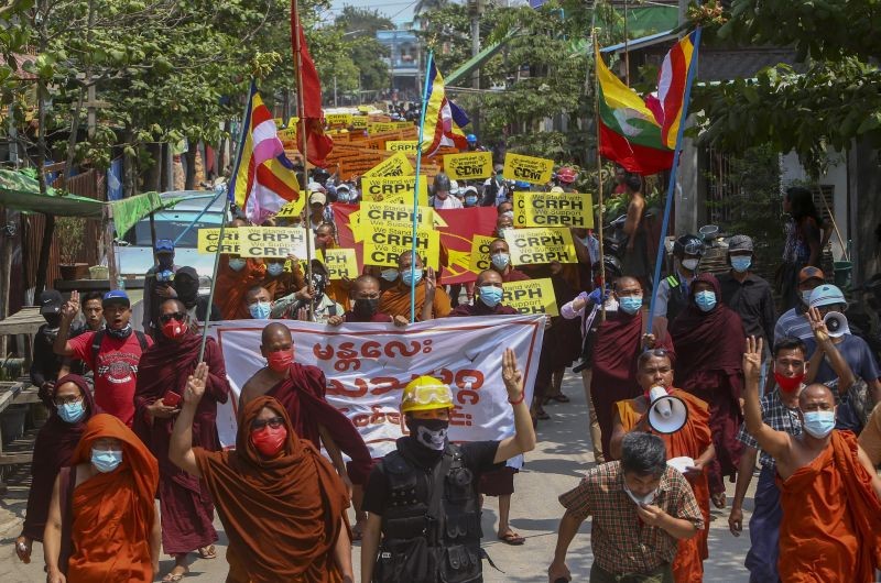 Buddhist monks lead a protest march supporting The Committee Representing Pyidaungsu Hluttaw, a Burmese government in exile representing National League for Democracy lawmakers ousted in Feb. 2021 military coup in Mandalay, Myanmar on March 17, 2021. Protesters against the military takeover in Myanmar were not relenting Wednesday as the deadly crackdown on peaceful demonstrations took an increasing toll. (AP/PTI Photo)