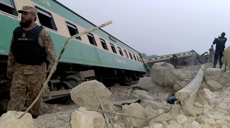 Army, police and rescue workers gather at the site of a derailed train in near Rohri, in southern Pakistan on March 7, 2021. Eight cars of a Lahore bound train derailed in southern Pakistan early Sunday, killing and injuring some passengers, officials said. (AP/PTI Photo)