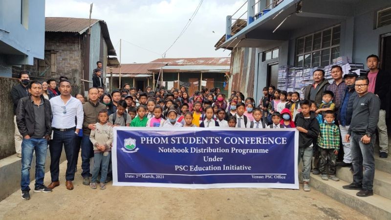 Members of Phom Students' Conference with officials and students during the notebook distribution programme at PSC office, Longleng on March 2.