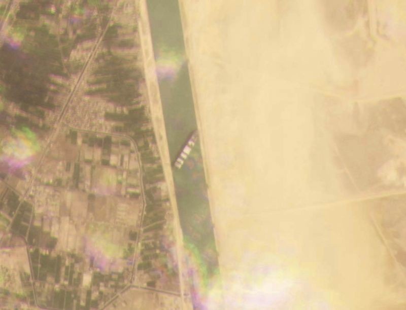This satellite image from Planet Labs Inc. shows the cargo ship MV Ever Given stuck in the Suez Canal near Suez, Egypt on March 23, 2021. A cargo container ship that's among the largest in the world has turned sideways and blocked all traffic in Egypt's Suez Canal, officials said Wednesday, March 24, 2021, threatening to disrupt a global shipping system already strained by the coronavirus pandemic. (AP/PTI Photo)