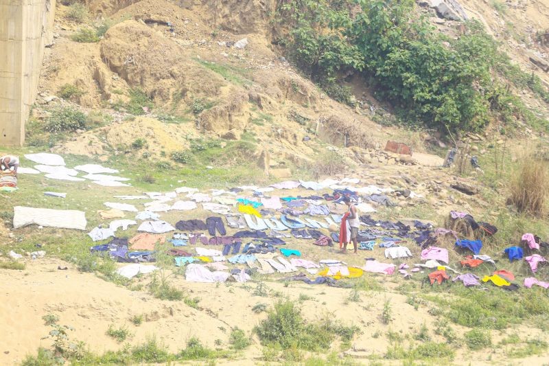 A dhobi (washerman) washes and dry clothes on the banks of the River Dhansiri in Dimapur on March 26. Dhobis are traditional laundry workers who wash clothes by hand and dry them in the sun, an occupation which has been in existence for generations. (Morung Photo by Soreishim Mahong)