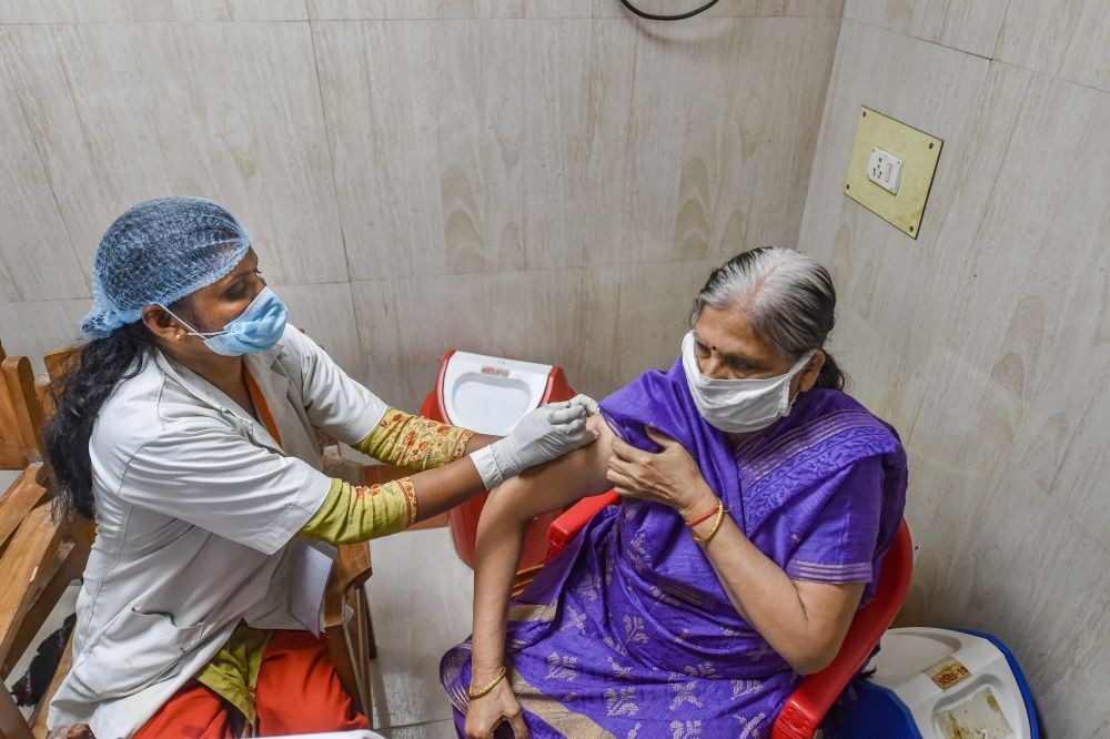 Lucknow: A medic administers the first dose of COVID-19 vaccine, during the second phase of a countrywide inoculation drive, at Civil Hospital in Lucknow, Thursday, March 4, 2021. (PTI Photo/Nand Kumar)