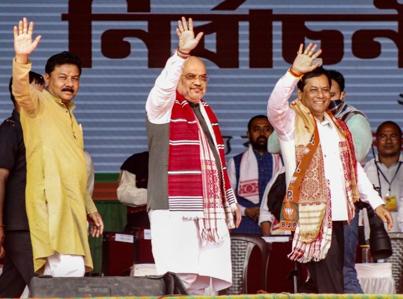 Union Home Minister Amit Shah with Assam CM Sarbananda Sonowal and BJP State President Ranjit Kumar Dass during an election rally in Majuli on March 22. (PTI Photo)