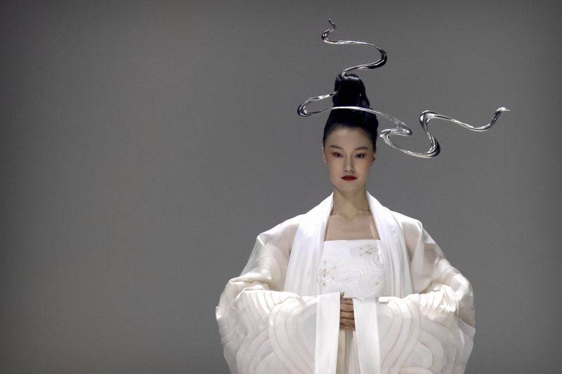 Beijing;  A model presents a creation inspired by traditional Chinese clothing from fashion brand Chuyan during China Fashion Week in Beijing, Saturday, March 27, 2021.AP/PTI