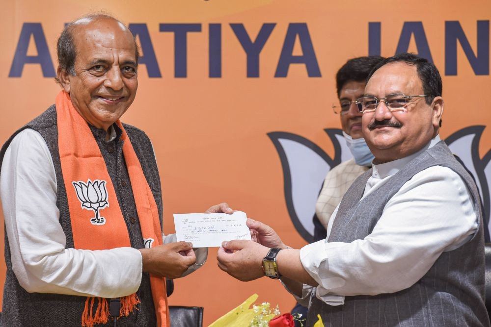 New Delhi: Former Union Minister Dinesh Trivedi receives the membership slip from BJP President J P Nadda as he joins the party, in New Delhi, Saturday, March 6, 2021. (PTI Photo/Atul Yadav)