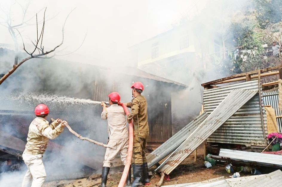Fire personnel can be seen fighting the fire at Kusong village, Noklak. Photo Courtesy: RO (E) (F&ES)