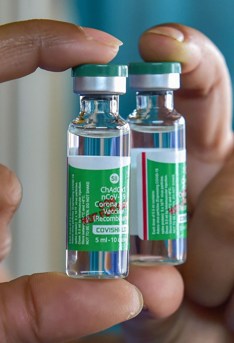 A health worker displays vials of COVID-19 vaccine at a private hospital, during the second phase of countrywide inoculation drive, in Bengaluru on March 1, 2021. (PTI Photo)