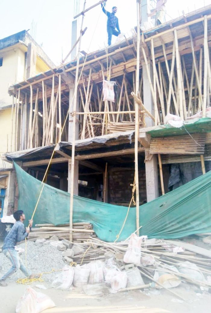 In this photo taken February 8, 2021, workers are seen hauling building materials using a makeshift pulley at a construction site in Dimapur. (Morung File Photo: For Representational Purposes Only)
