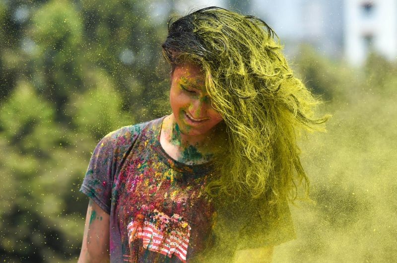 A woman during celebration of 'Holi' festival amid spike in COVID-19 cases, in Mumbai on March 29, 2021. (PTI Photo)