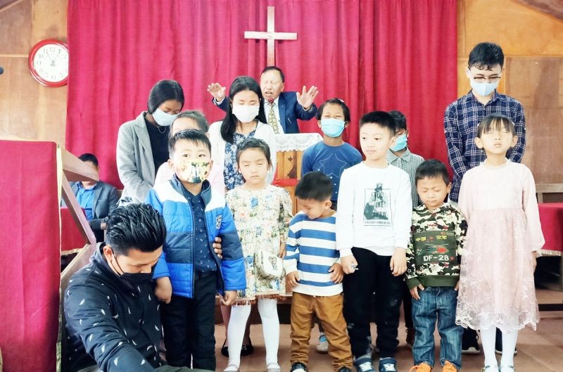Rev N Silubo Zeliang, Pastor of Kohima Liangmai Baptist Church, D Block blessing the Sunday school children on LBA Children’s Day of Prayer organised by the Liangmai Baptist Association Nagaland on March 14. (Photo Courtesy: Media Cell KLBC Kohima)