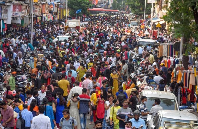 Flouting social distancing norms, people throng Dadar market ahead of the Diwali festival in Mumbai. Photograph: PTI Photo