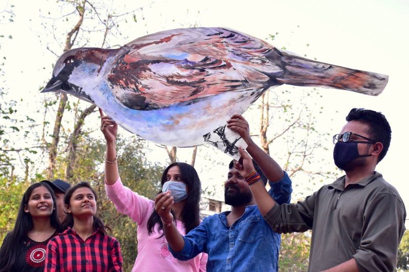 Jabalpur: Fine Art students display a cutout of a sparrow during an awareness campaign on the occasion of World Sparrow Day, in Jabalpur, Saturday, March 20, 2021. (PTI Photo)
