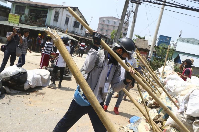 Protesters prepare to defend themselves as they gather in Tarkata township, Yangon, Myanmar on March 20, 20201. Protests against last month's military takeover continued Saturday in cities and town across Myanmar despite a crackdown by security forces that has taken more than 200 lives. (AP Photo)
