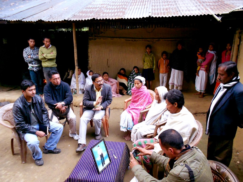 In this image, activists from NPMHR and MASS are seen here interacting with parents of Janak Moran at Motapung village, near Makum in upper Assam.