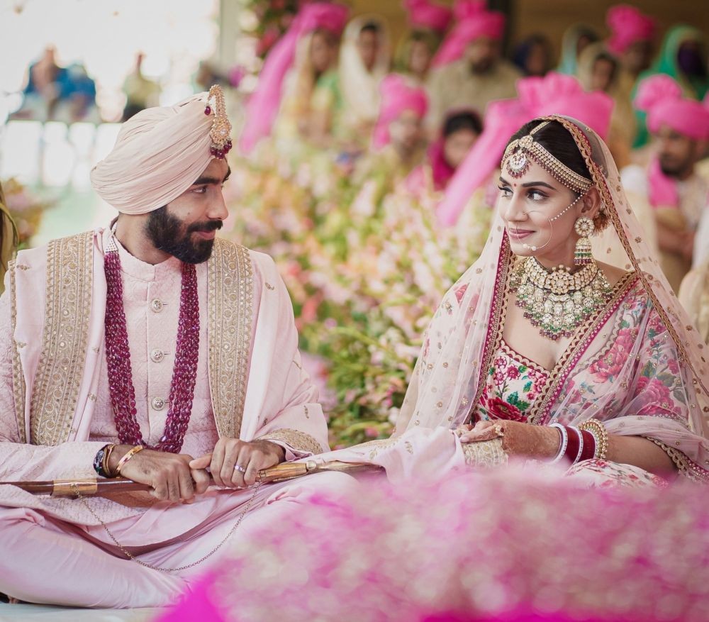 Jasprit Bumrah & Sanjana Ganesan. (IANS Photo)