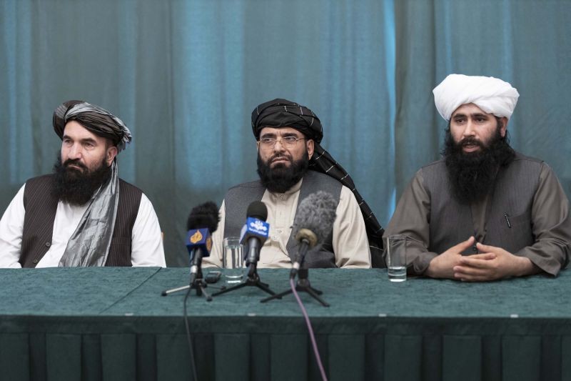 Members of the Taliban delegation from the left: Khairullah Khairkhwa, former western Herat Governor and one of five Taliban released from the U.S. prison on Guantanamo Bay in exchange for U.S. soldier Bowe Bergdahl, Suhail Shaheen, member of negotiation team, Mohammad Naeem, spokesman for the Taliban's political office attend their joint news conference in Moscow, Russia on March 19, 2021. The Taliban warned Washington against defying a May 1 deadline for the withdrawal of American and NATO troops from Afghanistan promising a "reaction".  (AP/PTI Photo)