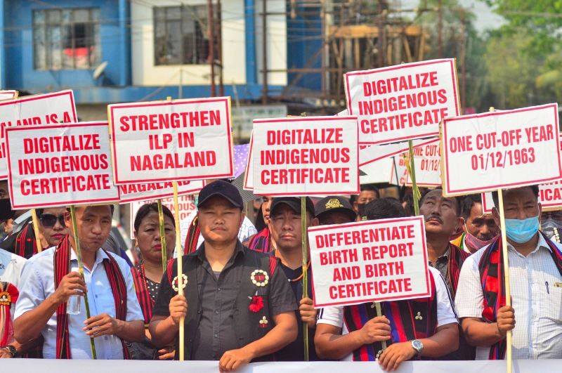 People hold placards during a public rally urging the Government to implement the Register of Indigenous Inhabitants of Nagaland (RIIN) and Inner Line Permit (ILP), at Dimapur in Nagaland, Friday, March 19, 2021. (PTI Photo)