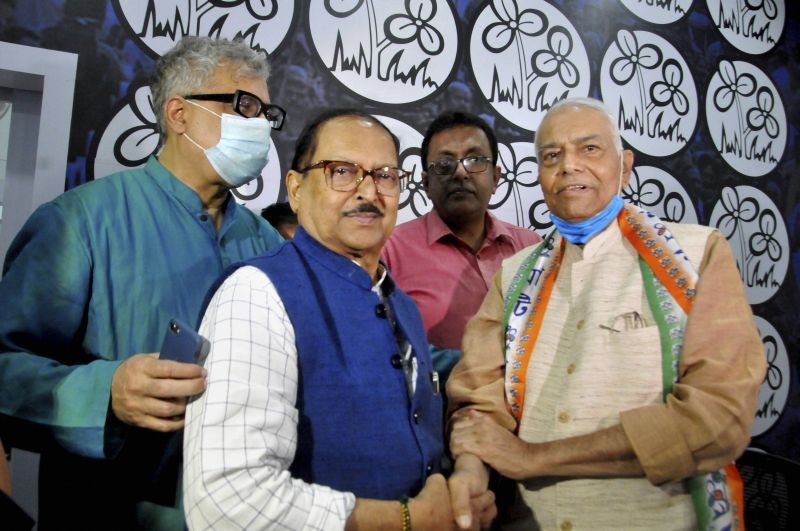 Kolkata: West Bengal Panchayat and Rural Development Minister Subrata Mukherjee (C) greets former BJP leader Yashwant Sinha (R) after he joined Trinamool Congress Party ahead of West Bengal Assembly Elections, in Kolkata, Saturday, March 13, 2021. Also seen is TMC leader Derek O'Brien (L). (PTI Photo)