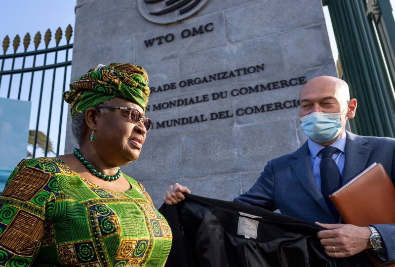 New Director-General of the World Trade Organisation Ngozi Okonjo-Iweala, left, walks at the entrance of the WTO, following a photo-op upon her arrival at the WTO headquarters to take office in Geneva, Switzerland on March 1, 2021. Nigeria's Ngozi Okonjo-Iweala takes the reins of the WTO amid hope she will infuse the beleaguered body with fresh momentum to address towering challenges and a pandemic-fuelled global economic crisis. (AP/PTI Photo)