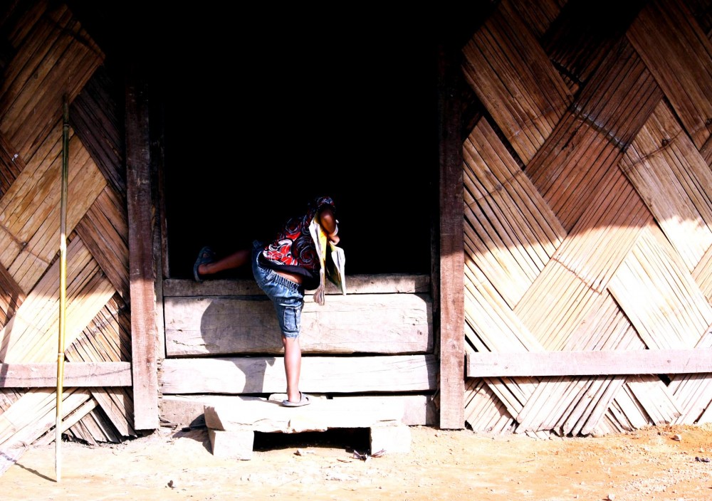 (File Photo) A little boy scales a jump as he enters his hut at a village in Nagaland. A report of the Ministry of Housing & Urban Poverty Alleviation in 2011 points convincingly to a probable rendezvous with increased slum population in the coming 5 years. Although poverty line has rapidly decreased to almost negligible since 2005, the estimation for rural and urban slum populations in the state seems ready for an upsurge in the coming years. (Caisii Mao Photo)