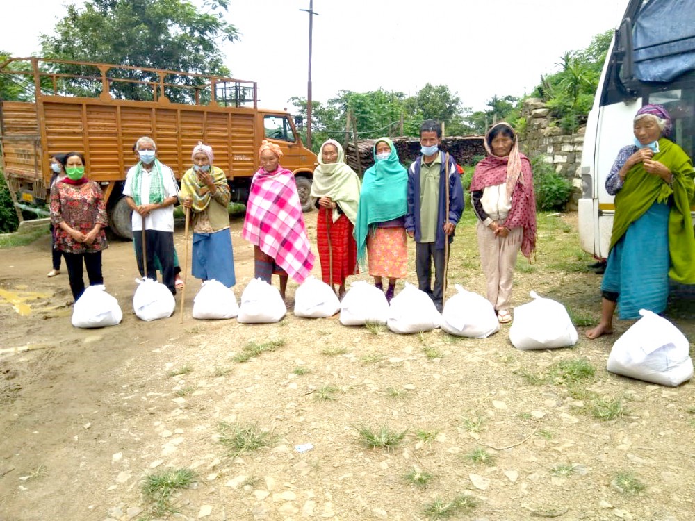 Senior citizens receiving relief materials distributed by Catholic church during the COVID-19 induced lockdown in Nagaland.