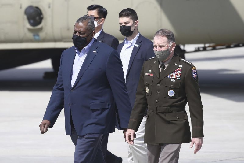 U.S. Secretary of Defense Lloyd Austin, left, walks with United States Forces Korea, Gen. Robert B. Abrams, after Austin arrived at Osan Air Base in Pyeongtaek, South Korea on March 17, 2021.  Austin, with U.S. Secretary of State Antony Blinken, on Wednesday, is visiting South Korea, with the focus of those talks being North Korea and its nuclear ambitions. (AP/PTI Photo)