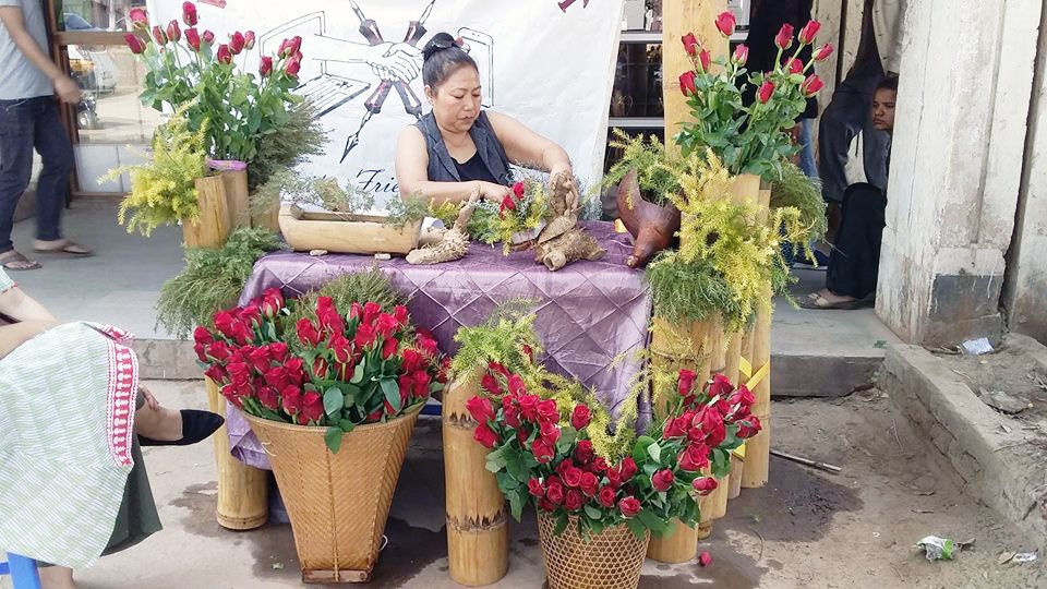 A member of Virtual Connect preparing the roses for sale. (Photo Courtesy: Virtual Connect)