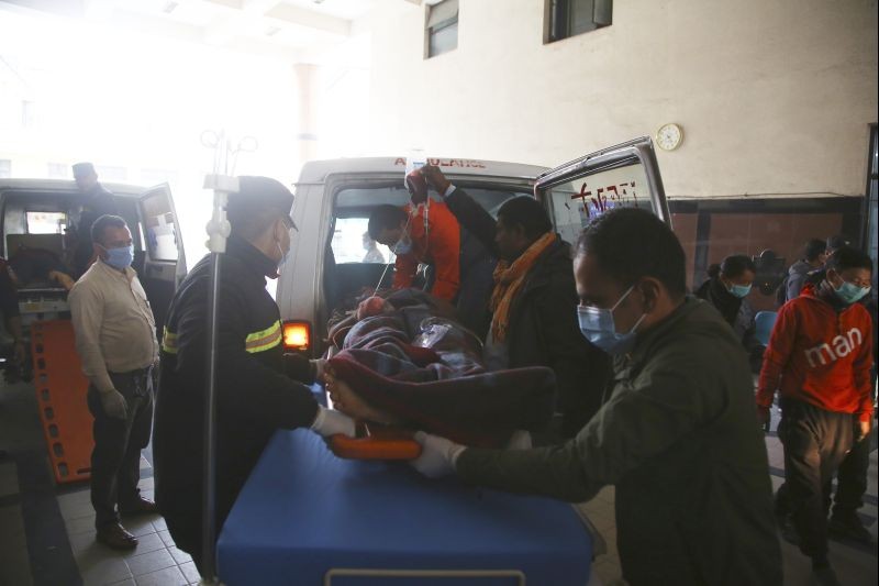 An injured person in a blast at southern Siraha district is brought to a hospital after he was airlifted to Kathmandu, Nepal on March 14. (AP/PTI Photo)